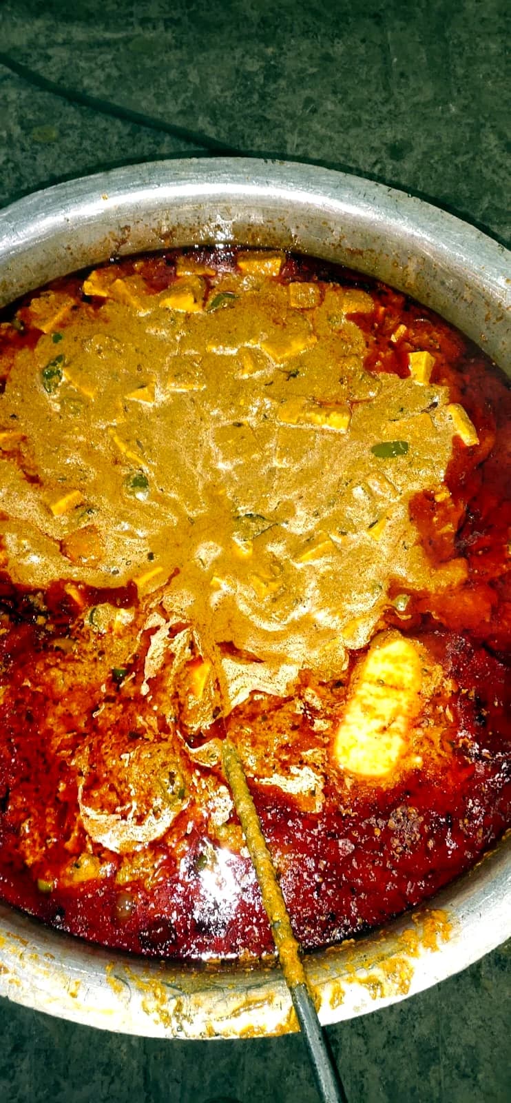 Vegetarian curry cooking in a large event pot